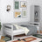 Grey sofa bed in a child’s room – scandi arrangement, wooden