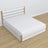 Double bed white with oak – wooden legs and base, close-up